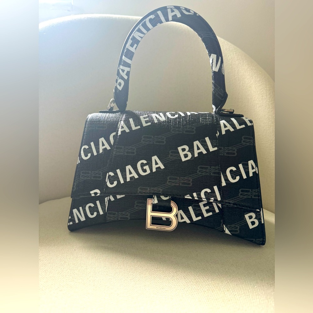 Balenciaga
Hourglass logo-print leather tote bag